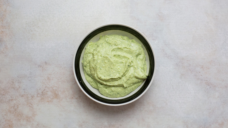 creamy green dip in bowl