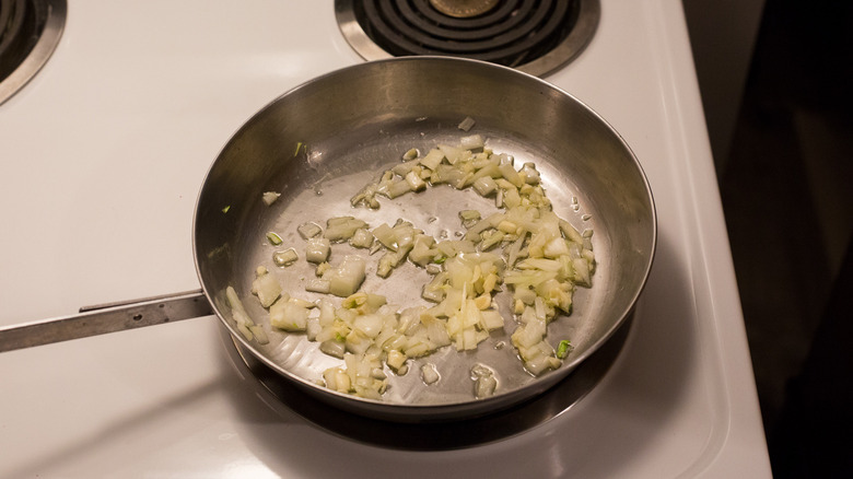 onion cooking in frying pan