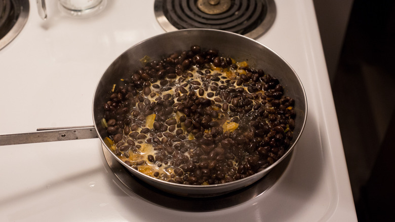 black beans cooking in pan