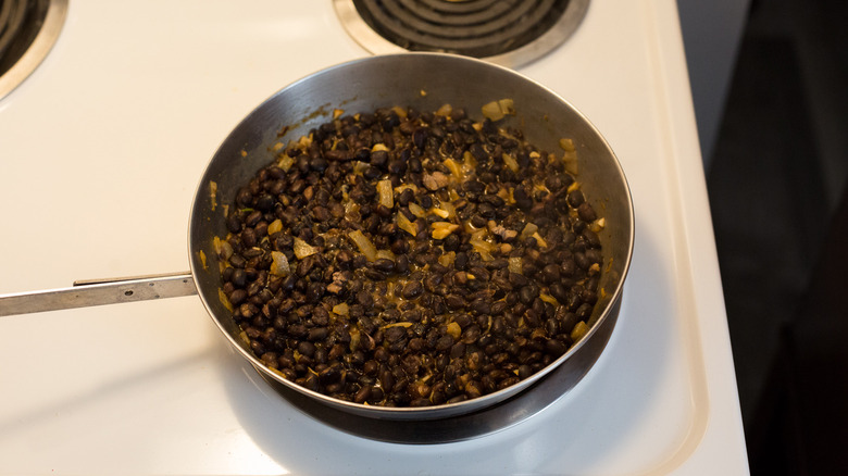 black beans cooking in pan