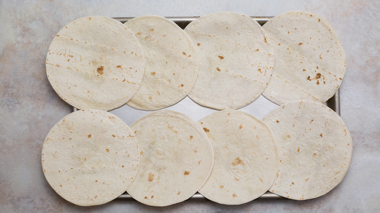 small tortillas on sheet pan