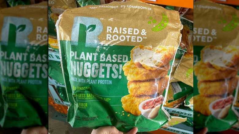 A hand holding a bag of the new nuggets