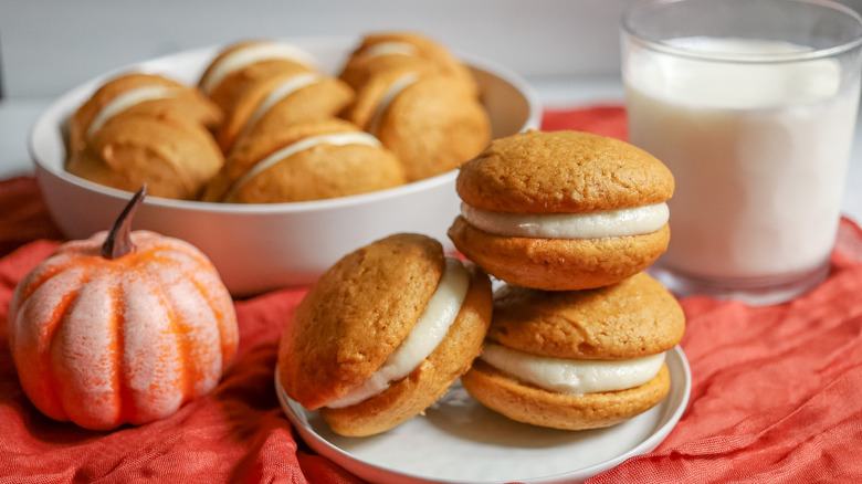 Pumpkin Whoopie pies on plate with more in background