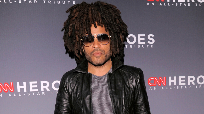 Lenny Kravitz poses on red carpet