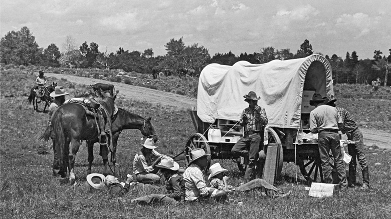 Cowboys gathered around the chuckwagon