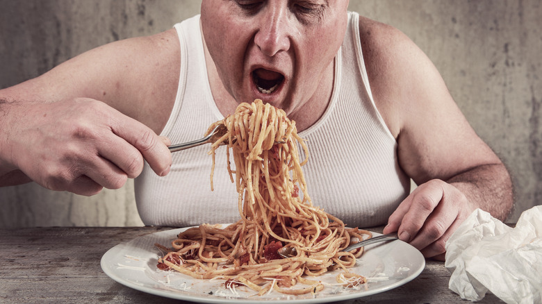 Man eating spaghetti