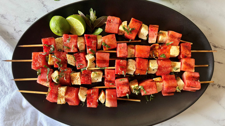 Watermelon and halloumi skewers garnished with mint