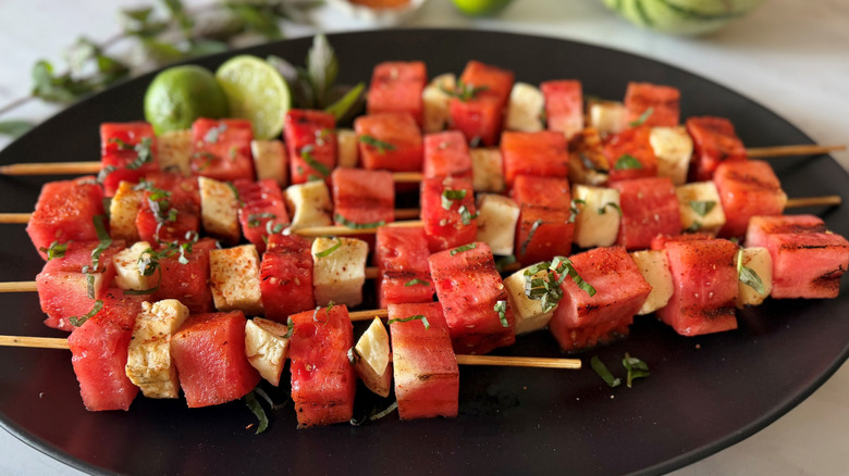 Watermelon and halloumi skewers on serving plate
