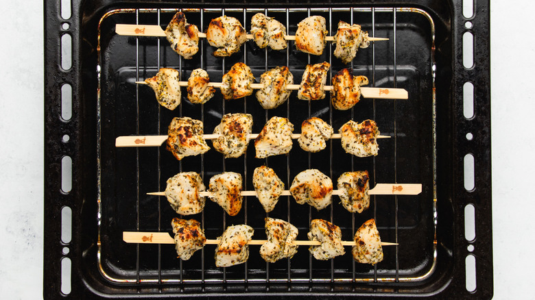 Chicken skewers on broiler rack