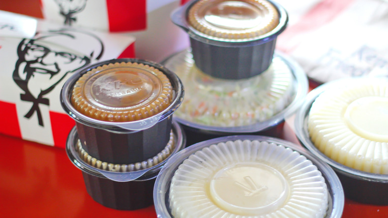 KFC mashed potatoes and other sides in sealed plastic to-go containers