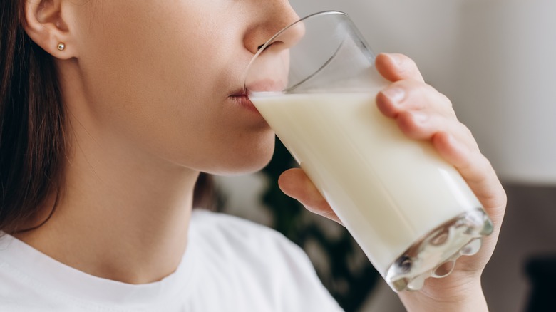 person drinking milk