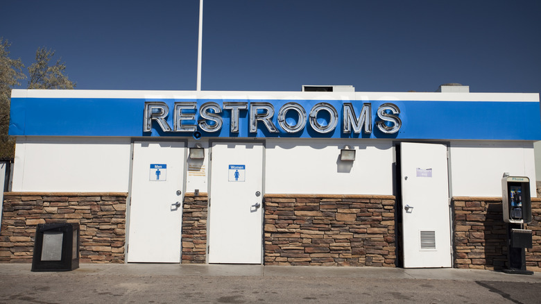 A restroom sign outside