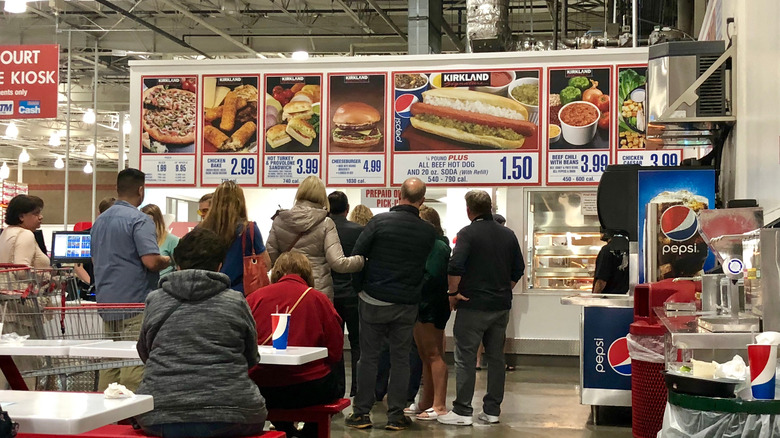 People standing in line at the Costco food court