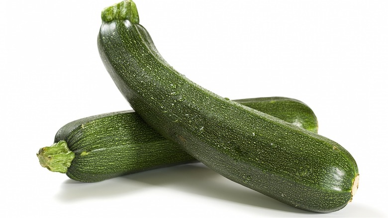 Two zucchinis on white background