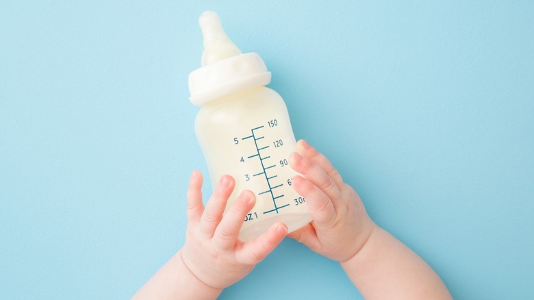 baby milk bottle on blue background