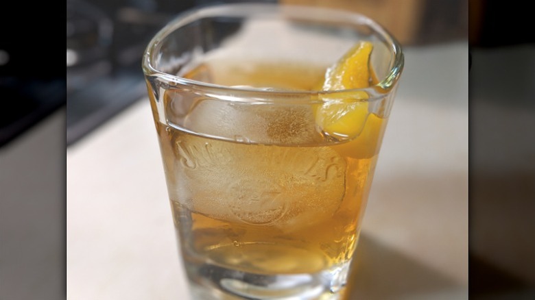 Kentucky colonel cocktail with a lemon twist