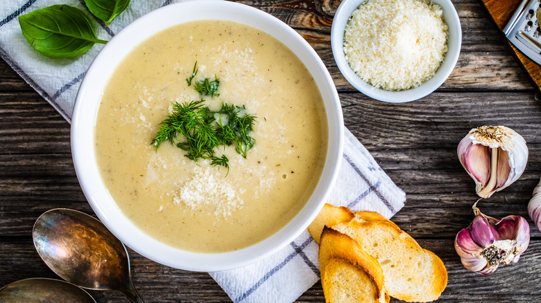 Bowl of garlic soup and bread