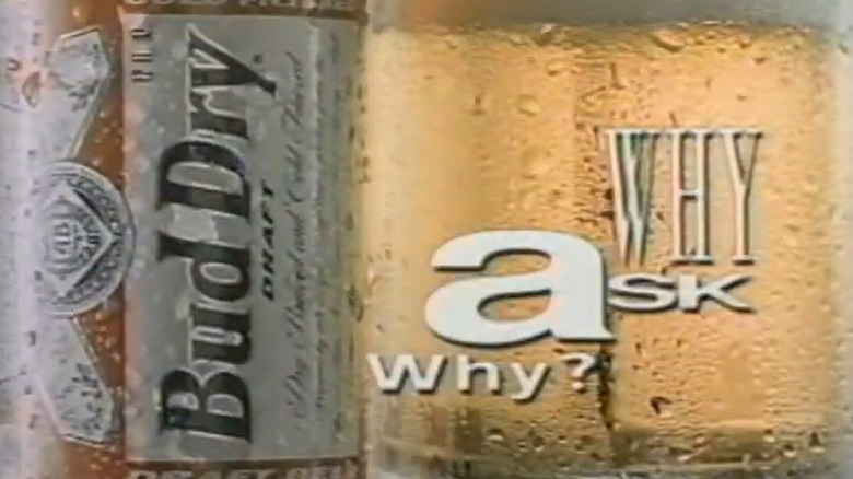 Still from a 1990s Bud Dry commercial featuring the "Why ask why?" tagline