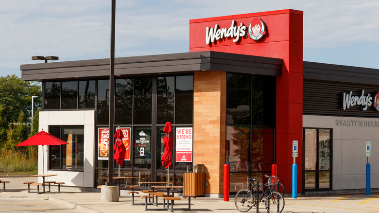 Wendy's restaurant with outside tables