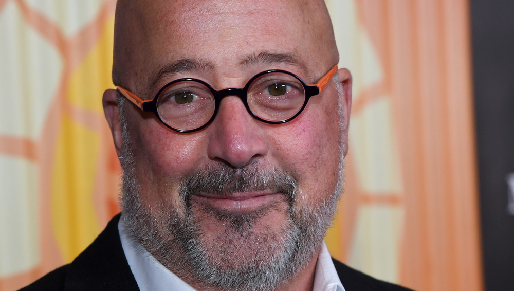 Andrew Zimmern in black and orange glasses