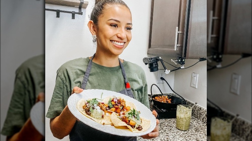 Chef Zoe Kelly posing with food