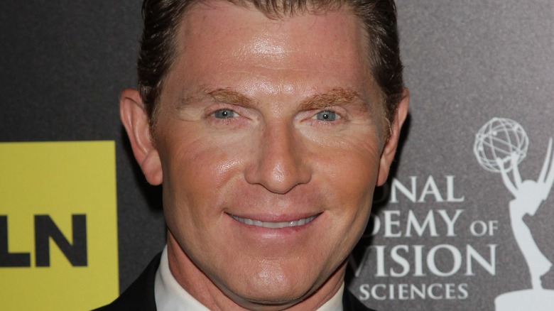 Bobby Flay smiling on red carpet