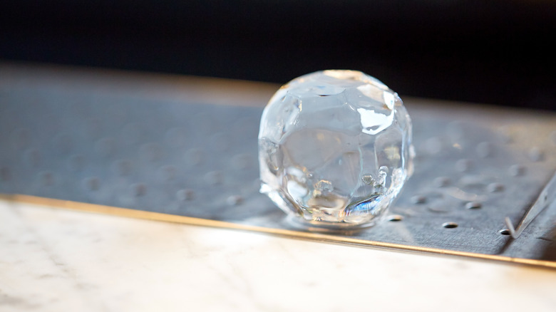 Hand-cut ice ball at bar