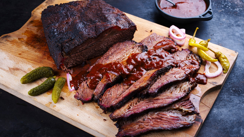 Sliced brisket on wooden cutting board