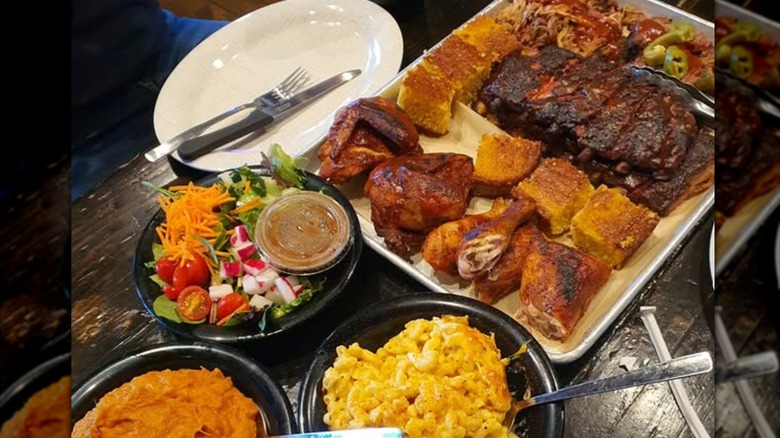 Spread of meats and sides at Dinosaur Bar-B-Q