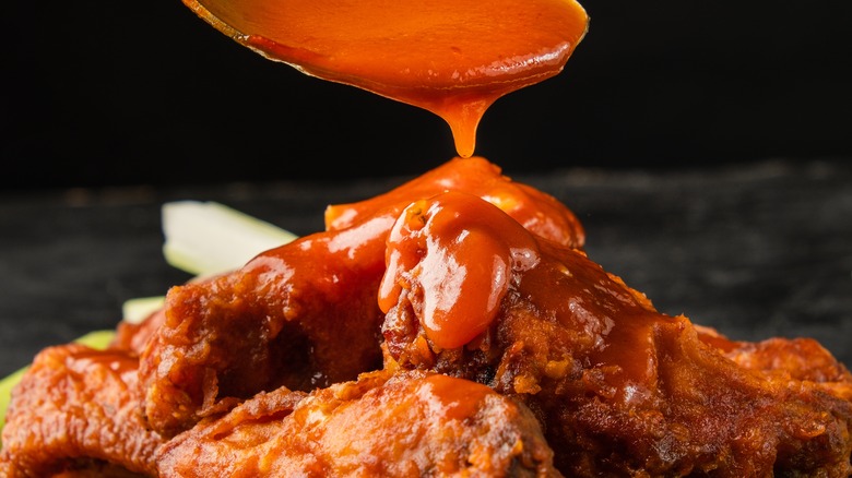 Barbecue sauce poured onto chicken