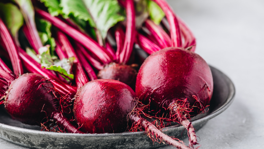 Fresh beets on a gray plate 