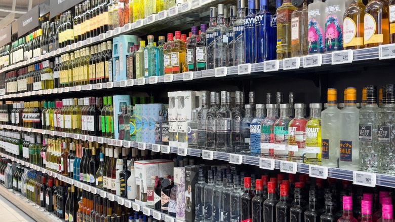 Array of vodka bottles on store shelves.
