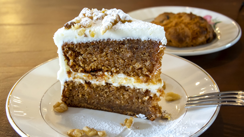 Slice of carrot cake on plate with fork