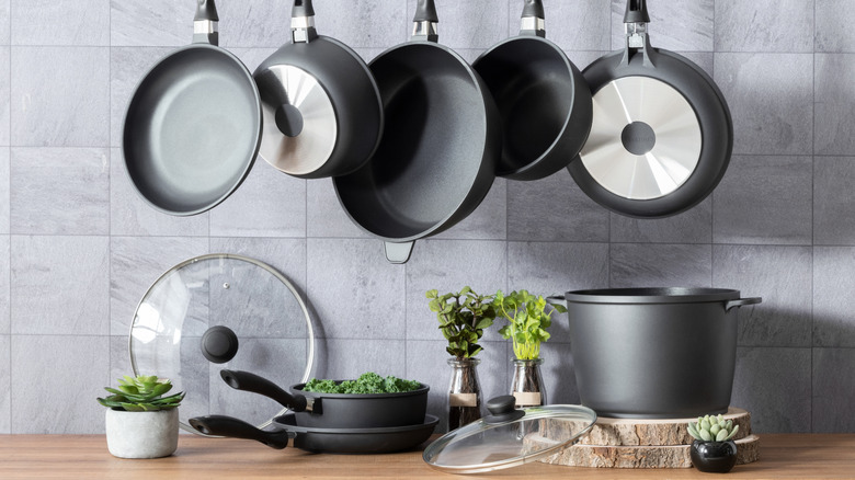 Pots and pans with lids in a modern kitchen