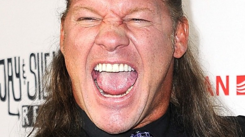 Chris Jericho making exaggerated wide smile