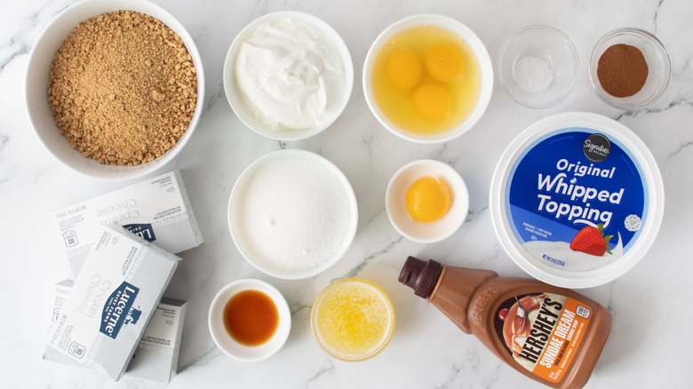 Sugar and spice snickerdoodle cheesecake ingredients on countertop