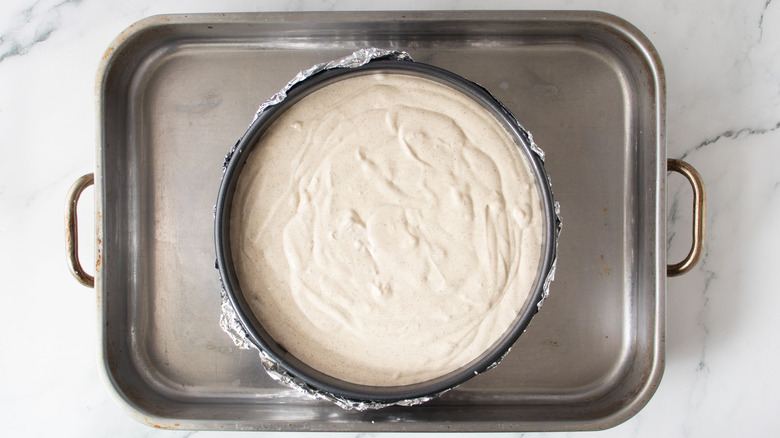 Unbaked cheesecake in pan