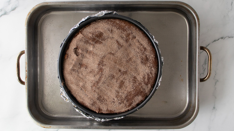 Cinnamon sugar cheesecake in roasting pan