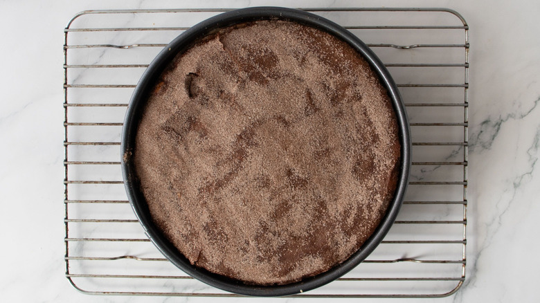 Cinnamon sugar cheesecake on wire rack