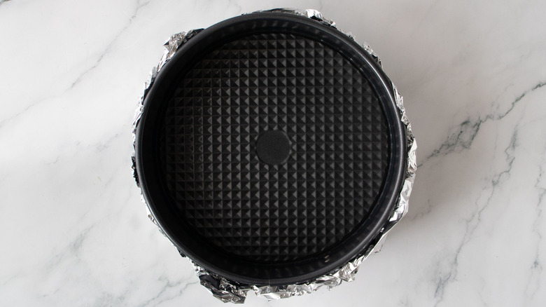 Springform pan wrapped in foil