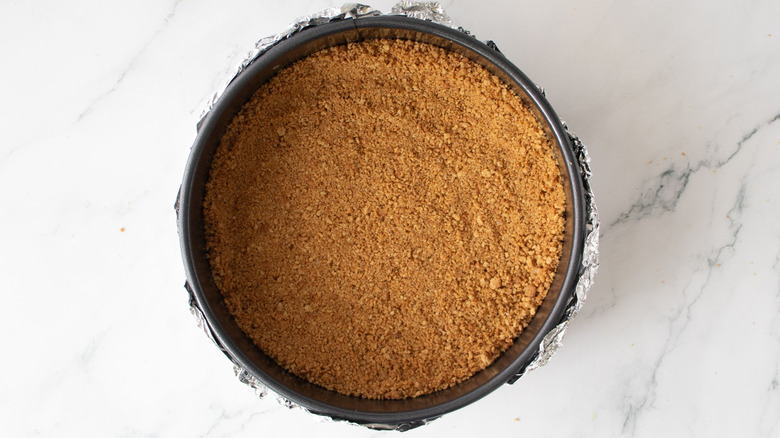 Graham cracker crust inside of springform pan