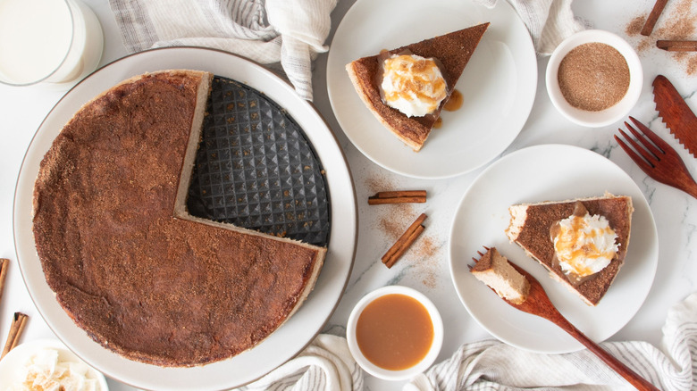 Snickerdoodle cheesecake next to slices of cheesecake on plates