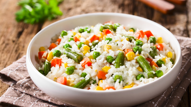 White bowl with rice and veggies