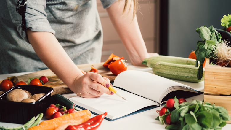 Home chef reads cookbook