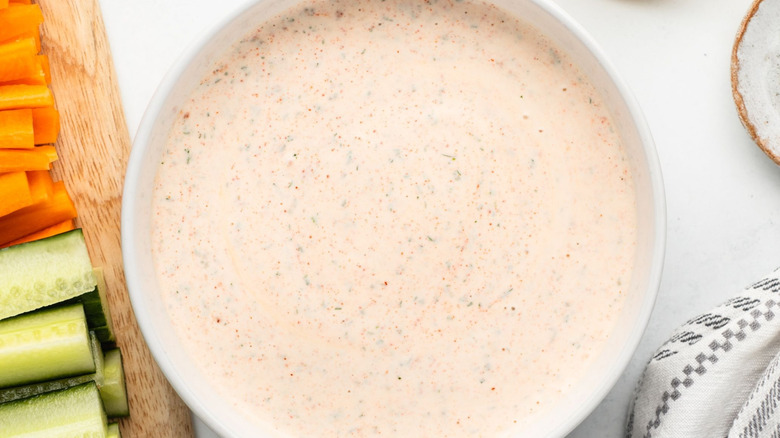 Bowl of blackened ranch next to crudites