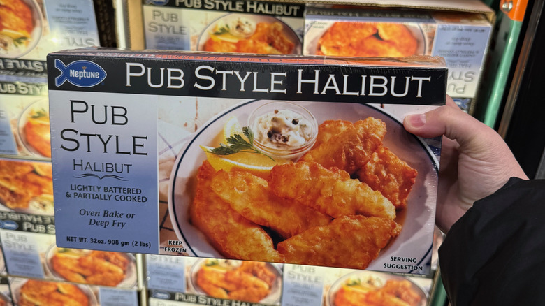 Hand holding Neptune frozen pub-style halibut
