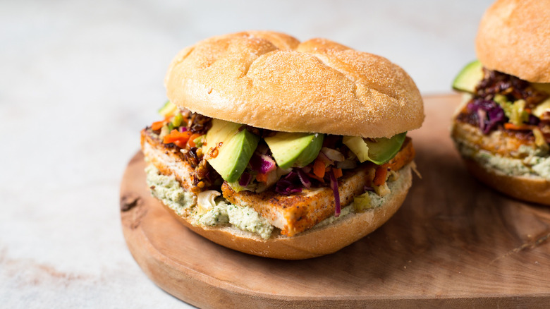 tofu sandwiches on wooden board