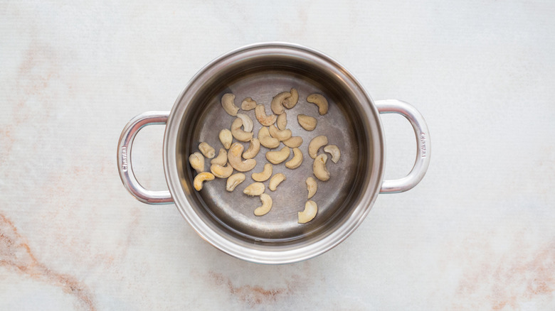 raw cashews in medium pot