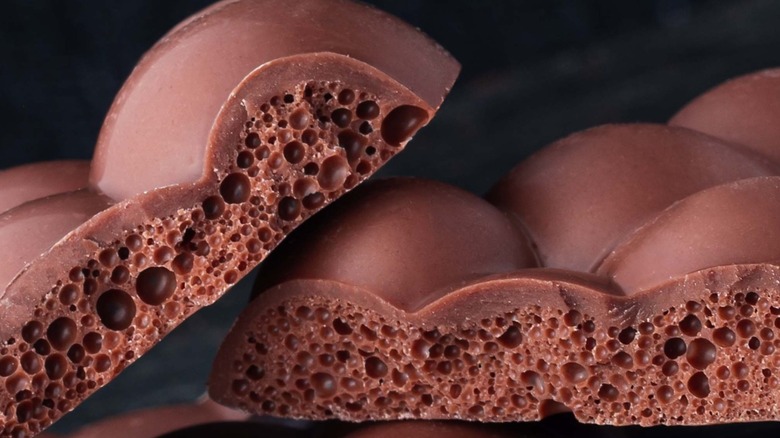 Close-up of chocolate bar with aerated center.