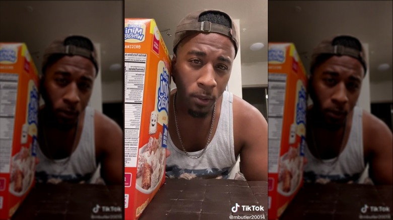 Person holding box of cereal